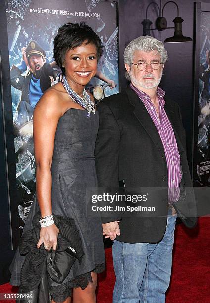 Director George Lucas and Mellody Hobson attend the "The Adventures of TinTin" New York premiere at the Ziegfeld Theatre on December 11, 2011 in New...
