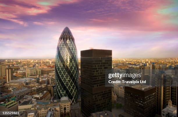 city at dusk - gherkin london stock pictures, royalty-free photos & images