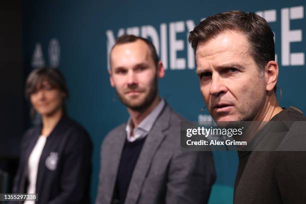 Sabine Loderer, head coach of the German U16 national women’s team, Tobias Haupt, head of the DFB Academy, and DFB Director Oliver Bierhoff talk to...