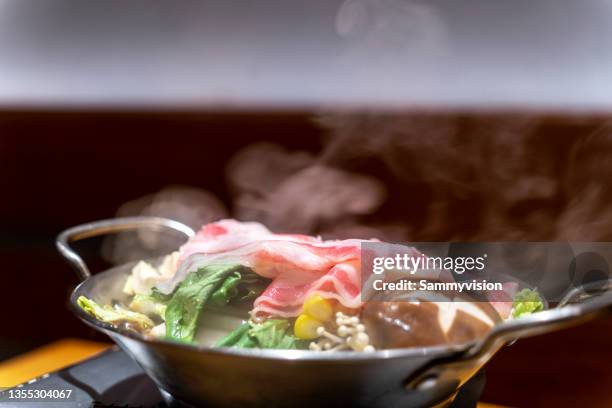 sukiyaki on the table - hot pots stock-fotos und bilder