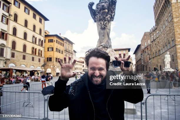 Artist Francesco Vezzoli poses for a photo as a lion in front of his The Francesco Vezzoli in Florence lion artwork installation "Pietà", in Piazza...