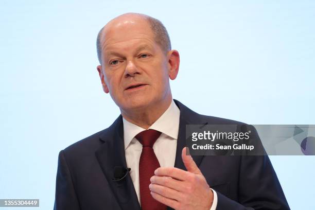 Olaf Scholz of the German Social Democrats , who will very likely become the next German chancellor, speaks to the media while he and leaders of the...