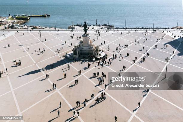 aerial view of praca do comercio square with people silhouettes, lisbon, portugal - sparse crowd stock pictures, royalty-free photos & images