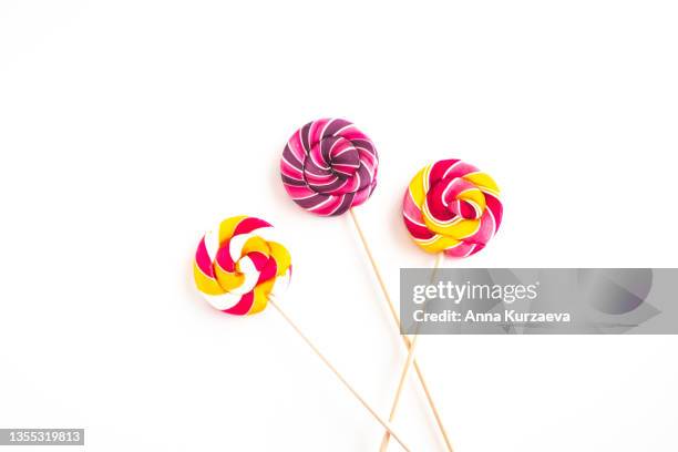 close up of assorted candy cane isolated on white background - bonbon stock-fotos und bilder