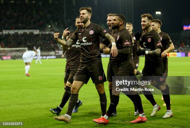 Guido Burgstaller of FC St. Pauli celebrate with his team mates after he scores the opening goal during the Second Bundesliga match between FC St....