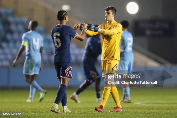 Warren Zaire-Emery and Lucas Lavallee of Paris Saint-Germain interact following their sides victory after the UEFA Youth League match between...