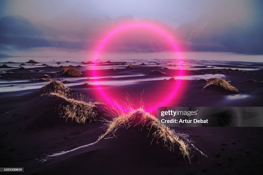 Digital red circle glowing in the dramatic landscape of Iceland.
