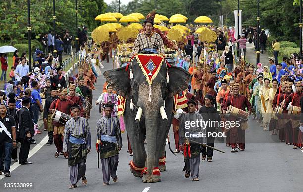 An elephant leads a farewell procession for the outgoing 13th king of Malaysia, Tuanku Mizan Zainal Abidin and Queen Nur Zahirah, leading to the...