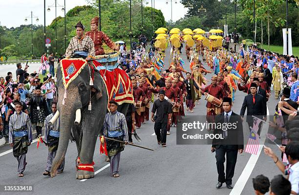 An elephant leads a farewell procession for the outgoing 13th king of Malaysia, Tuanku Mizan Zainal Abidin and Queen Nur Zahirah, leading to the...