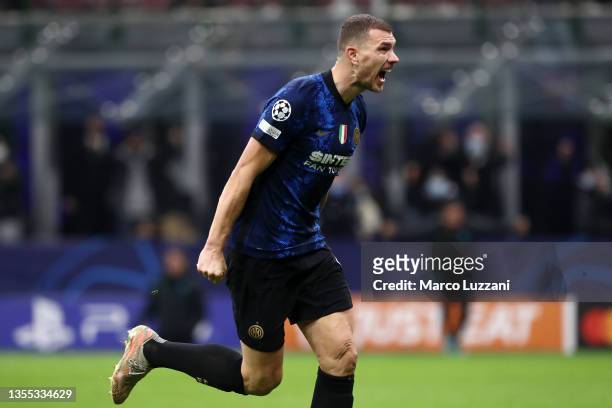 Edin Dzeko of FC Internazionale celebrates after scoring their side's first goal during the UEFA Champions League group D match between FC...