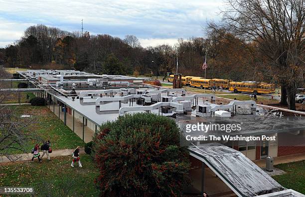 Students head for their buses at the end of the school day at Fuqua School on November 17 in Farmville, VA. Fuqua School is one of the former...