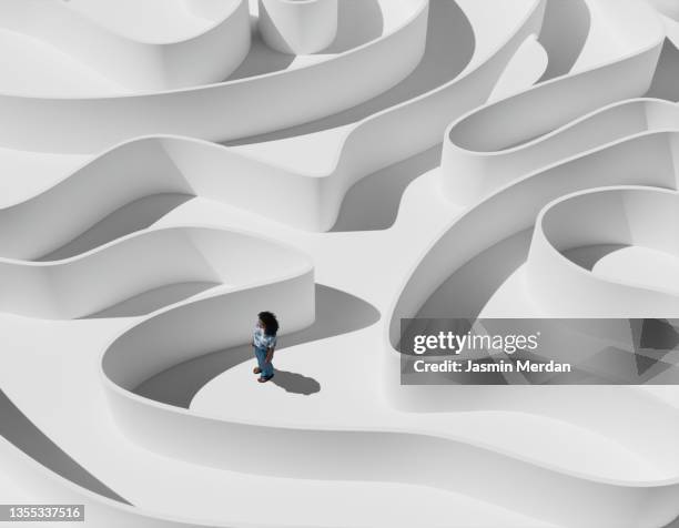 young woman in maze - aufgabe stock-fotos und bilder