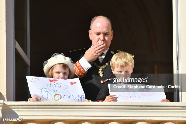 Prince Albert II of Monaco with his children Princess Gabriella of Monaco and Prince Jacques of Monaco appear at the Palace balcony during the Monaco...