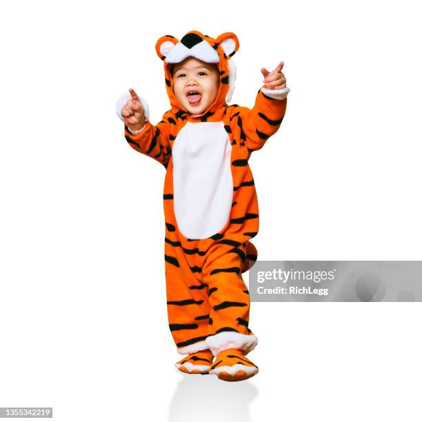 little girl in a tiger costume - mystical baby girls stock pictures, royalty-free photos & images