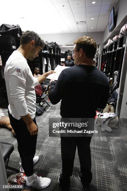 Jimmy Garoppolo and Quarterbacks Coach Rich Scangarello of the San Francisco 49ers in the locker room before the game against the Jacksonville...