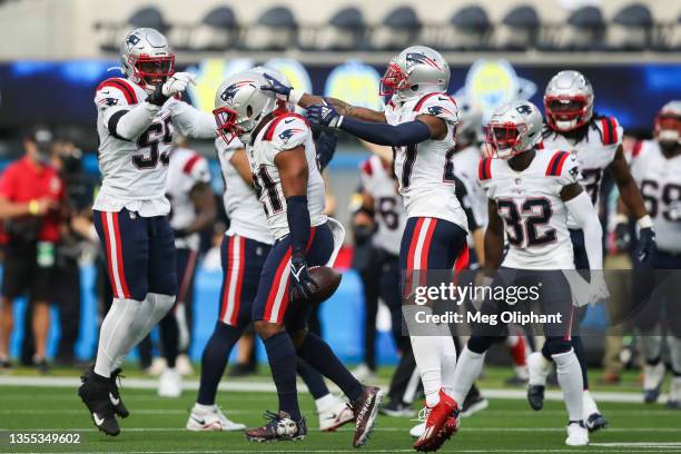 Adrian Phillips of the New England Patriots celebrates his interception in the second quarter against the Los Angeles Chargers at SoFi Stadium on...