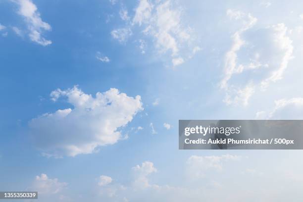 low angle view of clouds in sky - aukid stock-fotos und bilder