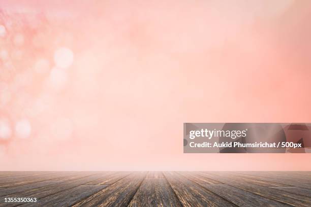 empty wooden table against sky during sunset - aukid stock-fotos und bilder