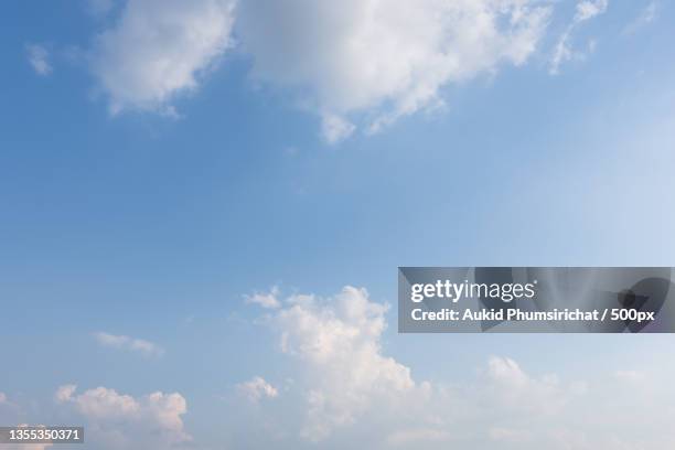 low angle view of clouds in sky - aukid stock-fotos und bilder