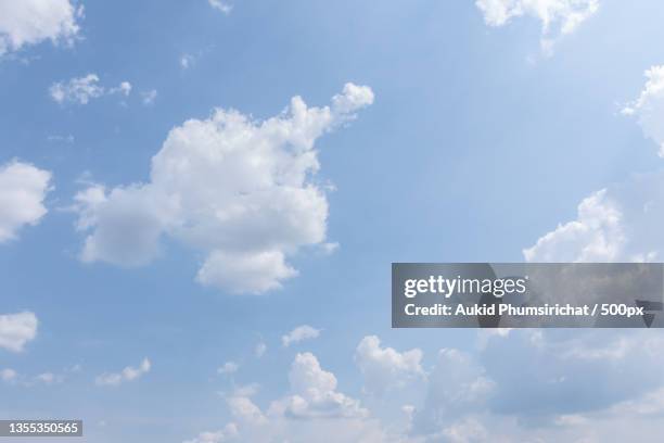 low angle view of clouds in sky - aukid stock-fotos und bilder