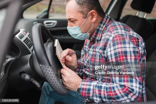 Driver Making Notes Driver Logbook Photos and Premium High Res Pictures - Getty Images