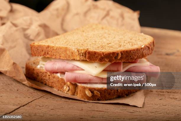 close-up of sandwich on cutting board - sandwiches stock pictures, royalty-free photos & images