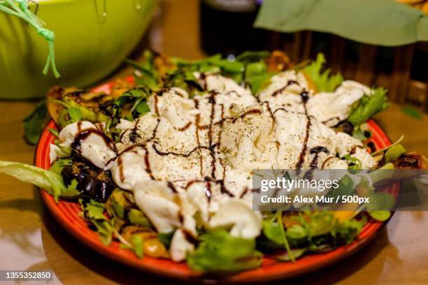 close-up of food served on table - mur cuisine stockfoto's en -beelden