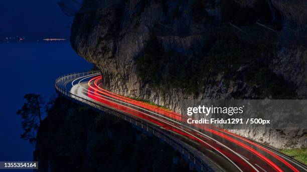 high angle view of light trails on road at night,switzerland - performance car stock pictures, royalty-free photos & images