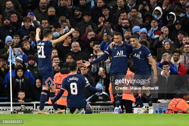 Kylian Mbappe of Paris Saint-Germain celebrates with teammates Ander Herrera, Leandro Paredes and Achraf Hakimi after scoring their team's first goal...