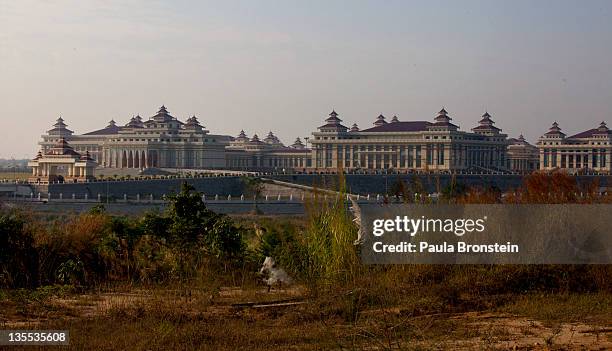 The massive Parliament building is seen surrounded by high gates and wide 10 lane roads December 5, 2011 in Nay Pyi Taw, Myanmar. NayPyiTaw is the...