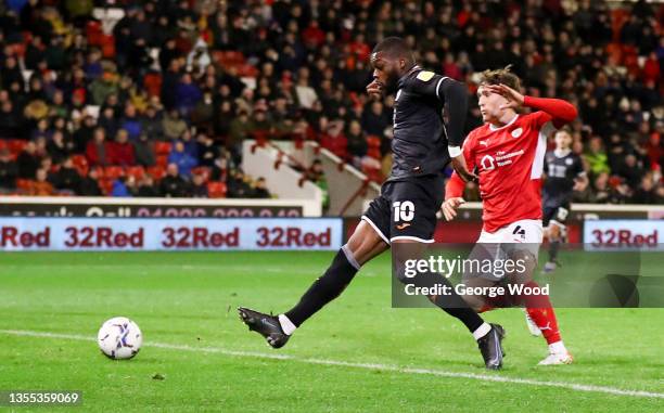 Olivier Ntcham of Swansea City scores their side's first goal during the Sky Bet Championship match between Barnsley and Swansea City at Oakwell...
