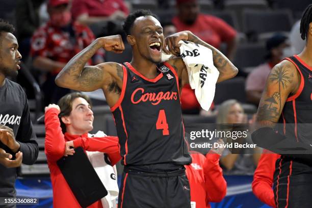 Taze Moore of the Houston Cougars reacts on the bench after a basket against the Oregon Ducks during the 2021 Maui Invitational basketball tournament...