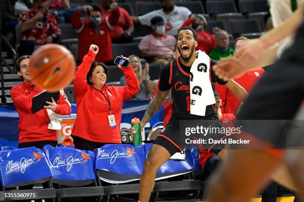 Kyler Edwards of the Houston Cougars reacts on the bench after a basket against the Oregon Ducks during the 2021 Maui Invitational basketball...