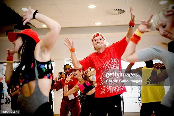 Sir Richard Branson takes part in an aerobics class at the grand opening of Maponya Mall's Virgin Active on December 10, 2011 in Soweto, South Africa...