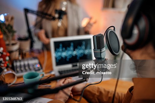 Young people recording podcast in studio Young people recording podcast in studio