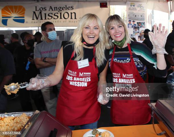Malin Akerman and January Jones attend the Los Angeles Mission's Annual Thanksgiving event at the Los Angeles Mission on November 24, 2021 in Los...