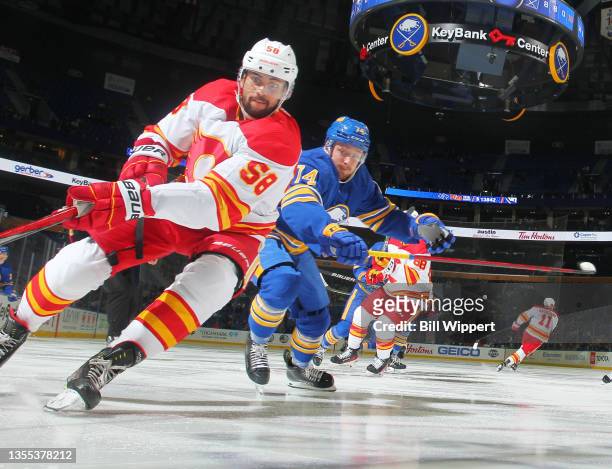 Oliver Kylington of the Calgary Flames skates during an NHL game against Rasmus Asplund of the Buffalo Sabres on November 18, 2021 at KeyBank Center...