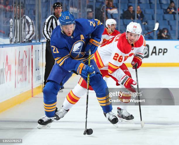 Kyle Okposo of the Buffalo Sabres skates during an NHL game against Elias Lindholm of the Calgary Flames on November 18, 2021 at KeyBank Center in...