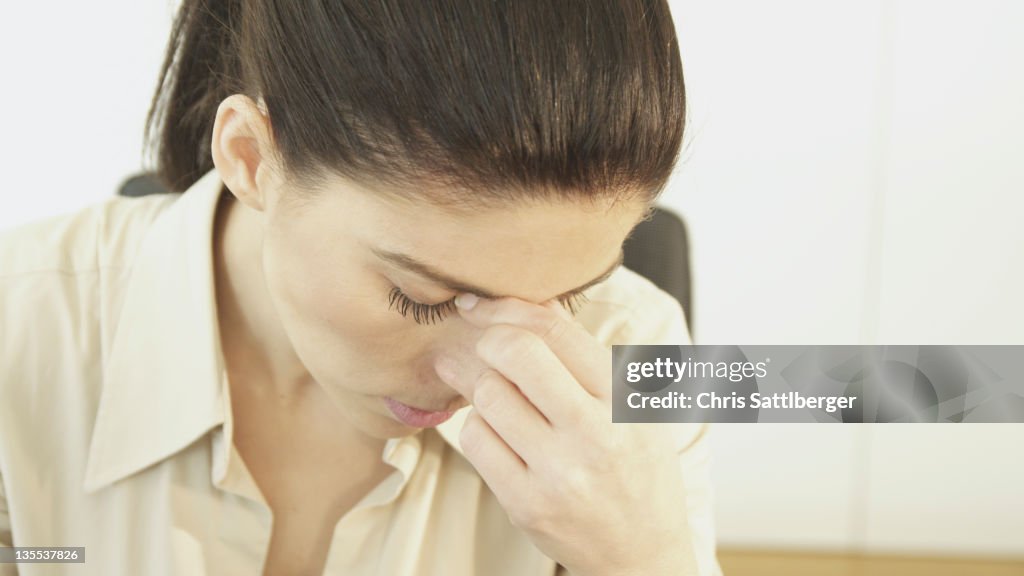 Frustrated Hispanic businesswoman