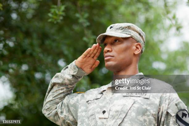 black soldier saluting - saluting stock pictures, royalty-free photos & images