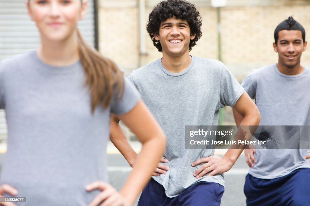 Teenagers standing in sportswear together