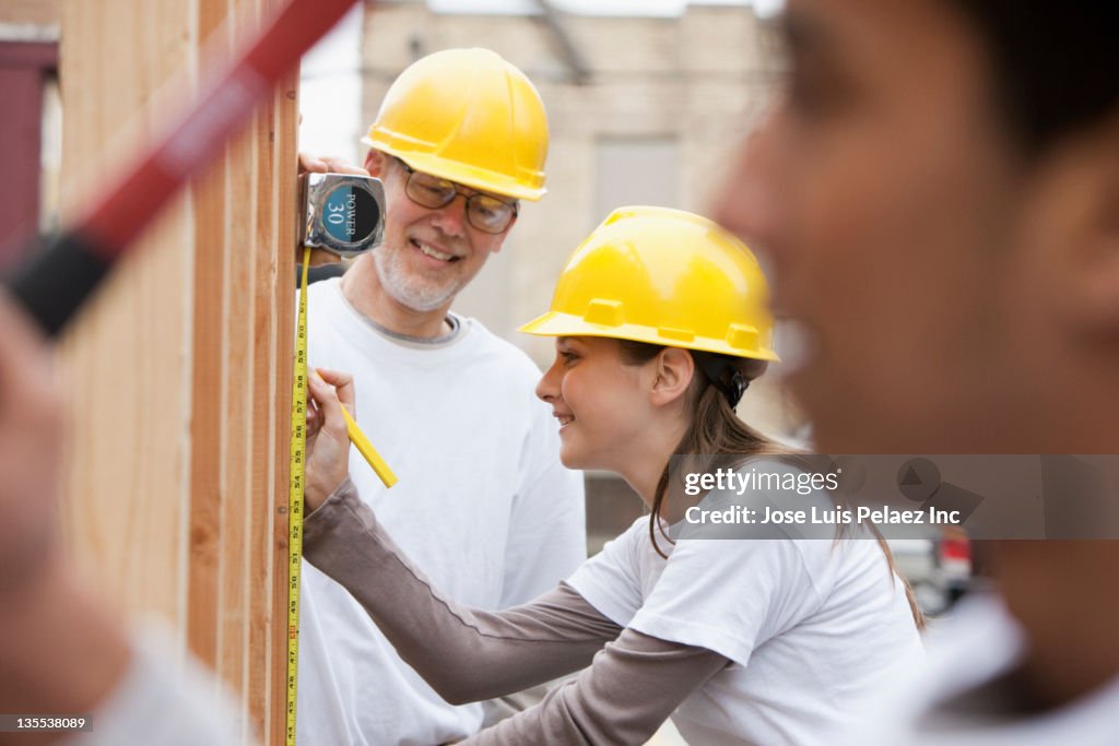 Volunteers working on construction site