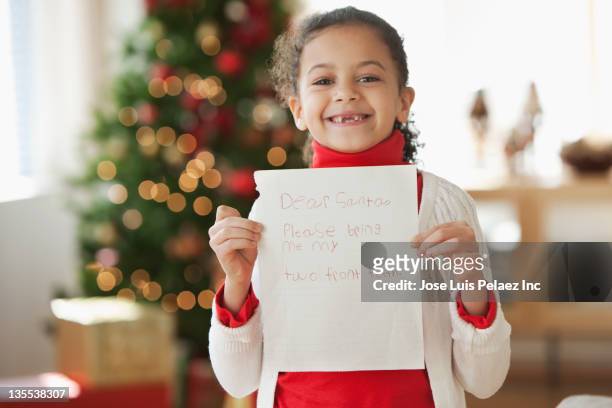 hispanic girl writing christmas letter to santa - child writing letter to santa stock pictures, royalty-free photos & images