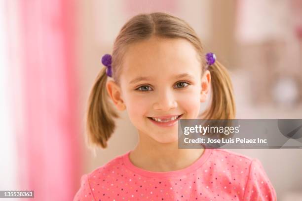 smiling mixed race girl with missing tooth - portrait of a young girl with gappy teeth and blond hair stock pictures, royalty-free photos & images