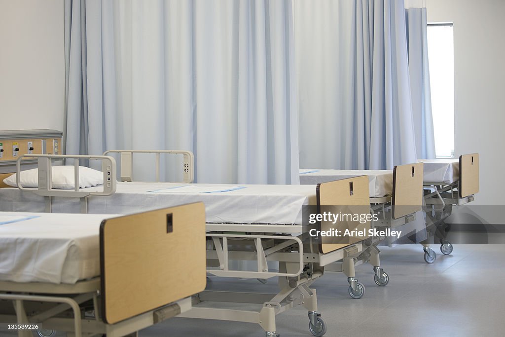 Empty hospital beds in hospital