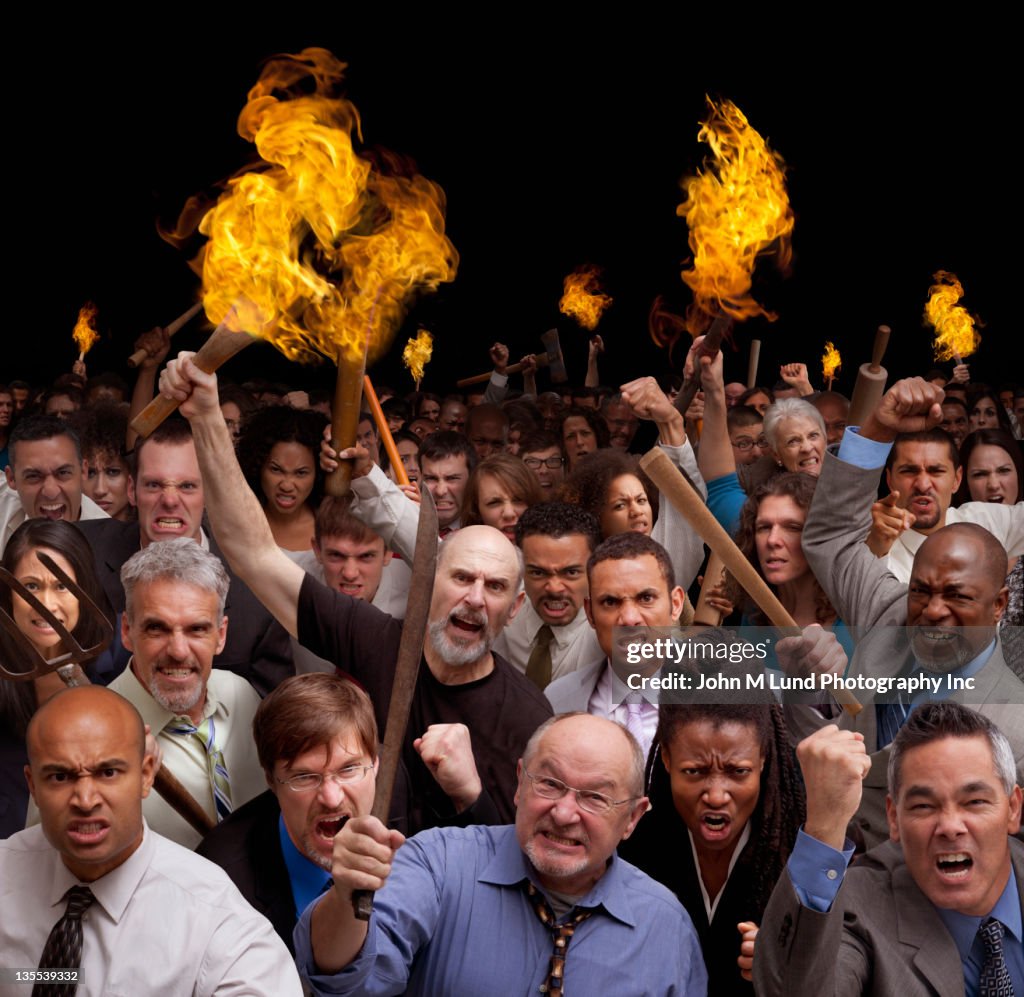 Angry crowd carrying torches