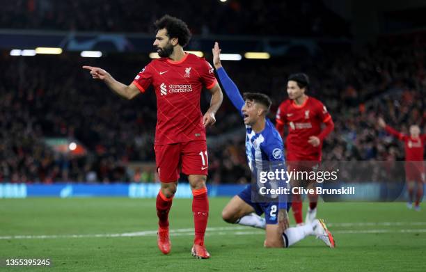 Mohamed Salah of Liverpool celebrates after scoring their side's second goal during the UEFA Champions League group B match between Liverpool FC and...