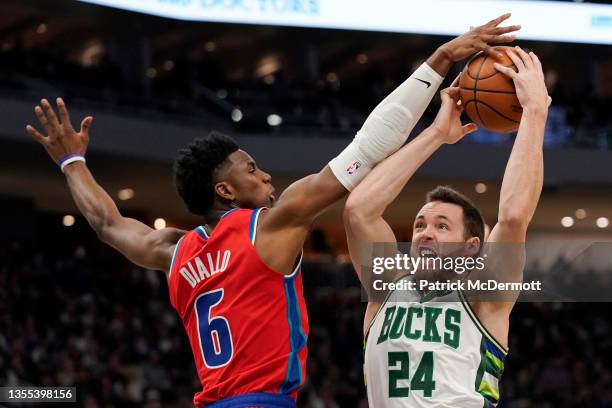 Hamidou Diallo of the Detroit Pistons blocks a shot by Pat Connaughton of the Milwaukee Bucks in the first half at Fiserv Forum on November 24, 2021...