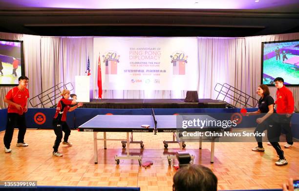 Retired Chinese table tennis player Wang Hao , Chinese table tennis player Fan Zhendong play a short match with Connie Sweeris and Judy Hoarfrost ,...