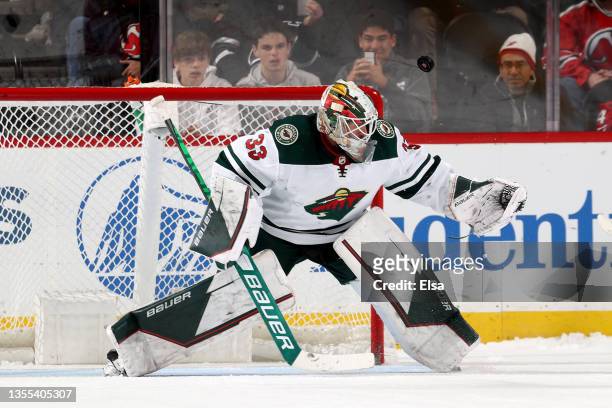 Cam Talbot of the Minnesota Wild stops a shot by Yegor Sharangovich of the New Jersey Devils in the shootout at Prudential Center on November 24,...
